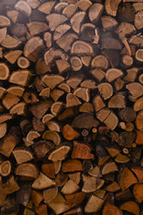 Chopped firewood for the fireplace. Autumn atmosphere in the mountains.