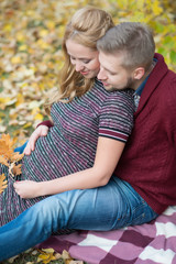 A portrait of young married couple expecting a baby