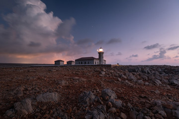 Fototapeta na wymiar Punta Nati lighthouse at night in Menorca, Spain.