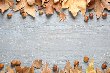 Frame made of autumn leaves on grey background. Space for text