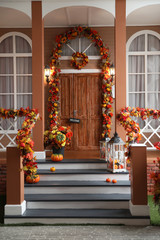 Fototapeta na wymiar House entrance decorated for traditional autumn holidays