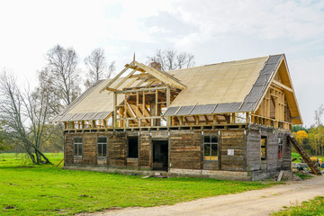 reconstruction of an old wooden house in a rural area