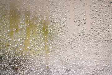 drops of autumn rain on the window macro