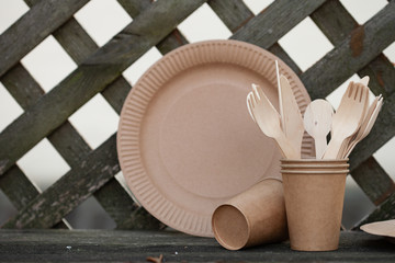 Set of eco, biodegradable paper coffee cups, wooden spoon fork napa. Zero waste, environmentally friendly, no plastic concept. Top view, copy space.