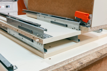 Assembly of hard furniture, close-up drawers for drawers