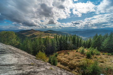 Beautiful view of the slopes of the Carpathian mountains covered in autumn forest