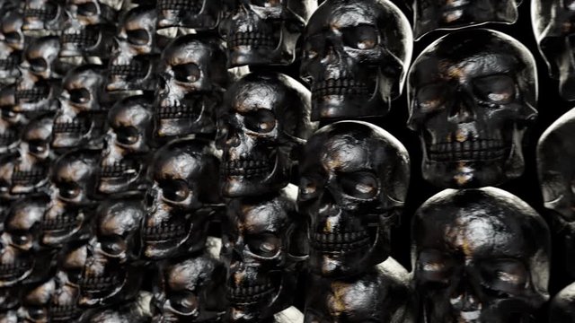 Wall of textured skulls. Horrible halloween concept. Seamless loop 3d render