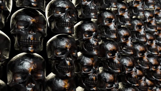 Wall of textured skulls. Horrible halloween concept. Seamless loop 3d render