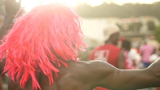 Man with red wig at carnival
