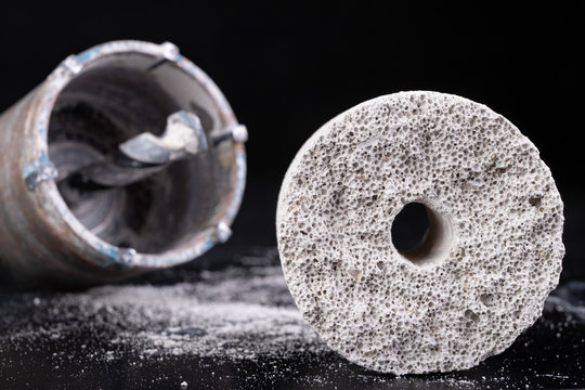 Steel large drill for drilling holes in concrete. Hole saw used to make holes for electrical boxes.