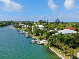 Fototapeta na wymiar Aerial view of Bay Island neighborhood and luxury villas next the ocean, in Sarasota, Florida, USA