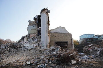 Demolished old soviet union building remains in contrast with modern building