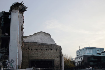 Demolished old soviet union building remains in contrast with modern building