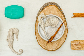 Aerial photography of aromatherapy elements on white wooden background