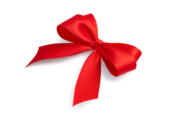 Side view of a beautiful red bright festive four-loop satin ribbon gift bow with gray light soft shadow isolated on white background