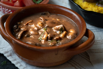 Mushroom brown sauce in clay pot