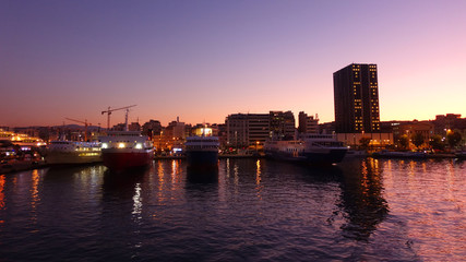 Busy port of Piraeus at dawn with beautiful sky colours, Attica, Greece