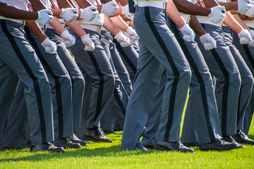 Lower body view of the gray uniform pants of Army cadets as they march