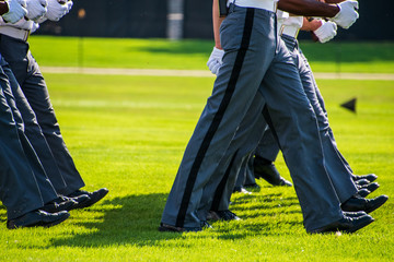Lower body view of the gray uniform pants of Army cadets as they march
