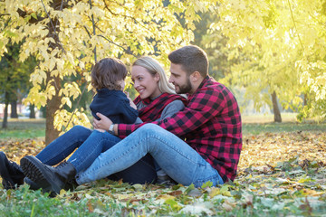Fototapeta premium Young family having fun outdoors, autumn,