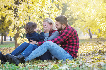 Fototapeta premium Young family having fun outdoors, autumn,