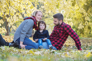 Fototapeta premium Young family having fun outdoors, autumn,