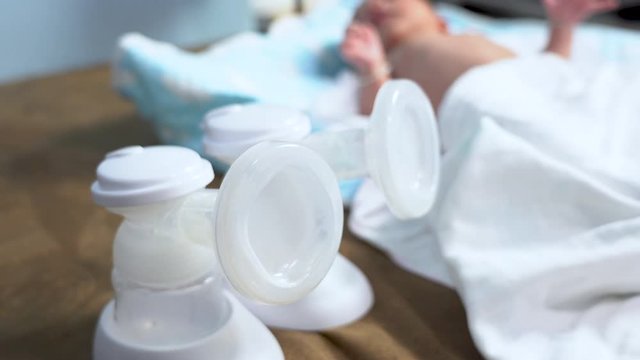 Close up of Breast pump on bed for baby 