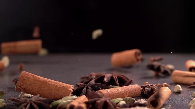 Falling Spices on Black Background Slow Motion