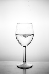 Glass with water up and splash