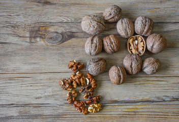 Walnuts closeup on a wooden background, selective focus