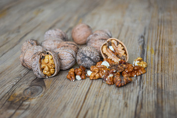 Walnuts closeup on a wooden background, selective focus
