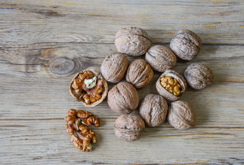 Walnuts closeup on a wooden background, selective focus