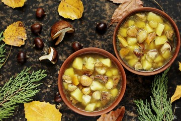 soup with mushrooms and chestnuts and potatoes. autumn soup. Italian and French food. copy space. top view. Flatlay