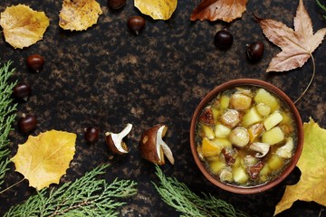 soup with mushrooms and chestnuts and potatoes. autumn soup. Italian and French food. copy space. top view. Flatlay