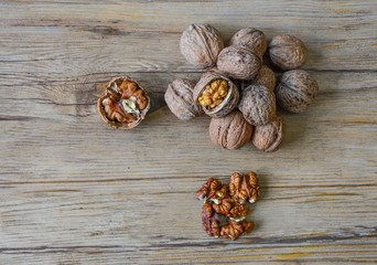Walnuts closeup on a wooden background, selective focus