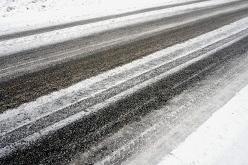 Beautiful winter landscape with snow-covered trees and road in Latvia.
