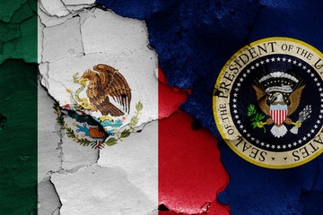 flags of Mexico and President of the United States painted on cracked wall