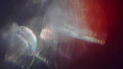 Light passes through glass, crystalline reflections from a prism. Different colors and hues. - Powered by Adobe