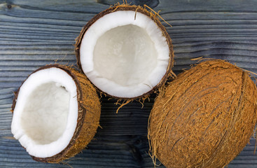 Top view of Half cut coconut on a rustic wooden table