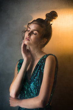 Young woman with smoke and movie light in a dark room
