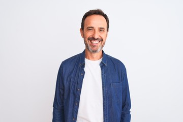 Middle age handsome man wearing blue denim shirt standing over isolated white background with a happy and cool smile on face. Lucky person.