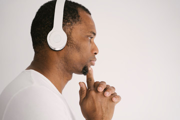 Listening to favorite tracks, keen on music, isolated on white studio background. Attractive...