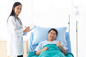 female doctor with happy patient at the hospital.