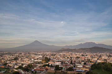 Panoramic view of the city, Popocatepetl volcano, San Gabriel Convent, the city is famous for its Great Pyramid, the largest archaeological site in the world at its base