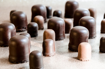 Black chocolate marshmallows in a group