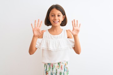 Young beautiful child girl wearing casual dress standing over isolated white background showing and...