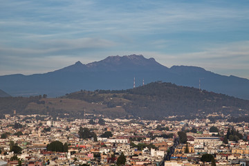 Panoramic view of the city, Popocatepetl volcano, San Gabriel Convent, the city is famous for its Great Pyramid, the largest archaeological site in the world at its base