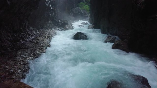 Spectacular wild water stream inside the rocky Partnach Gorge in Garmisch-Partenkirchen / Germany.