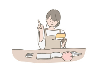 家計簿をつける若い女性