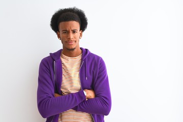 African american man wearing purple sweatshirt standing over isolated white background skeptic and...